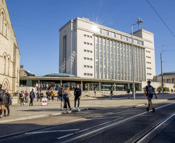A bright sunny day frames a typical sight on the NTU campus. in the foreground is the tram tracks and to the mid and top of the photo is the newton building, the edge of Arkwright building and many students and staff walking across. A bright sunny day frames a typical sight on the NTU campus. in the foreground is the tram tracks and to the mid and top of the photo is the newton building, the edge of Arkwright building and many students and staff walking across.
